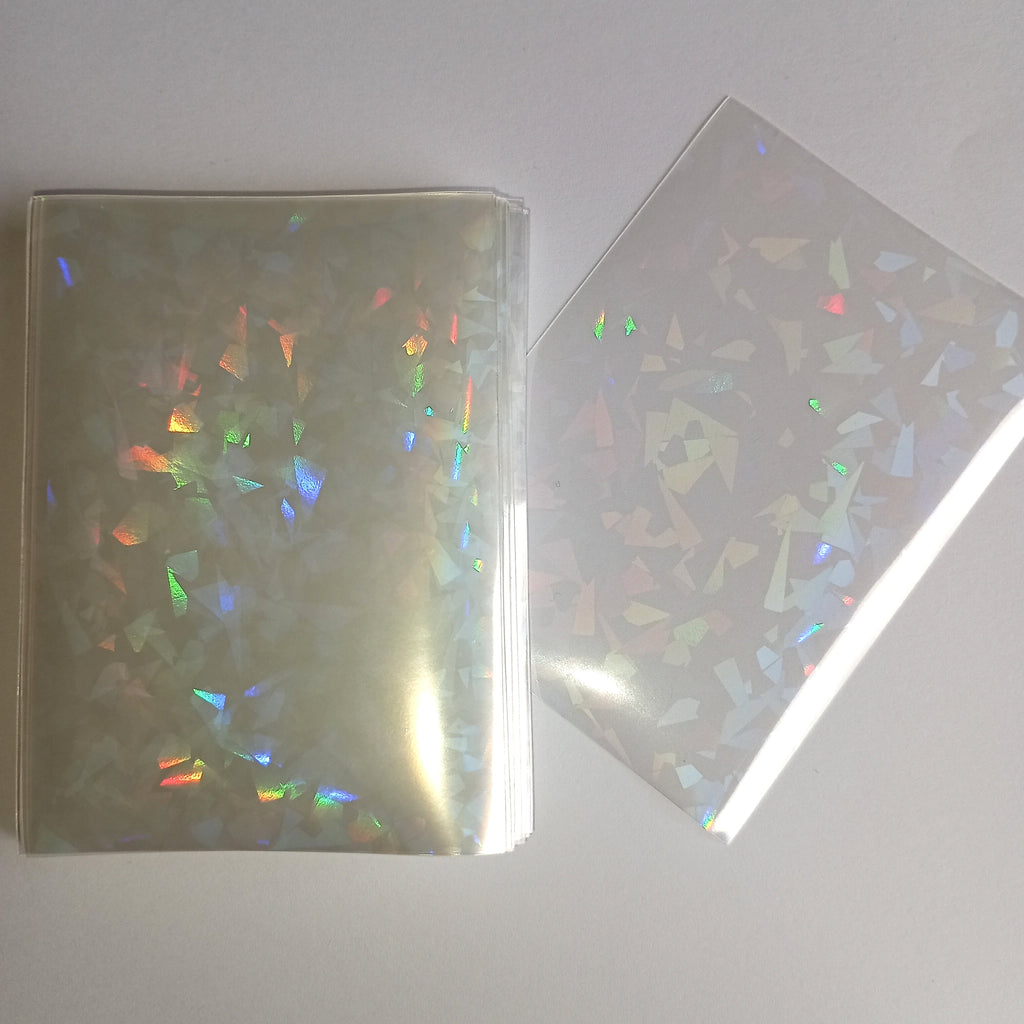50 vnt. holografinės kortelių įmautės (sleeves) 65×90 mm – Pokémon, MTG, TCG kortelėms Gemstones