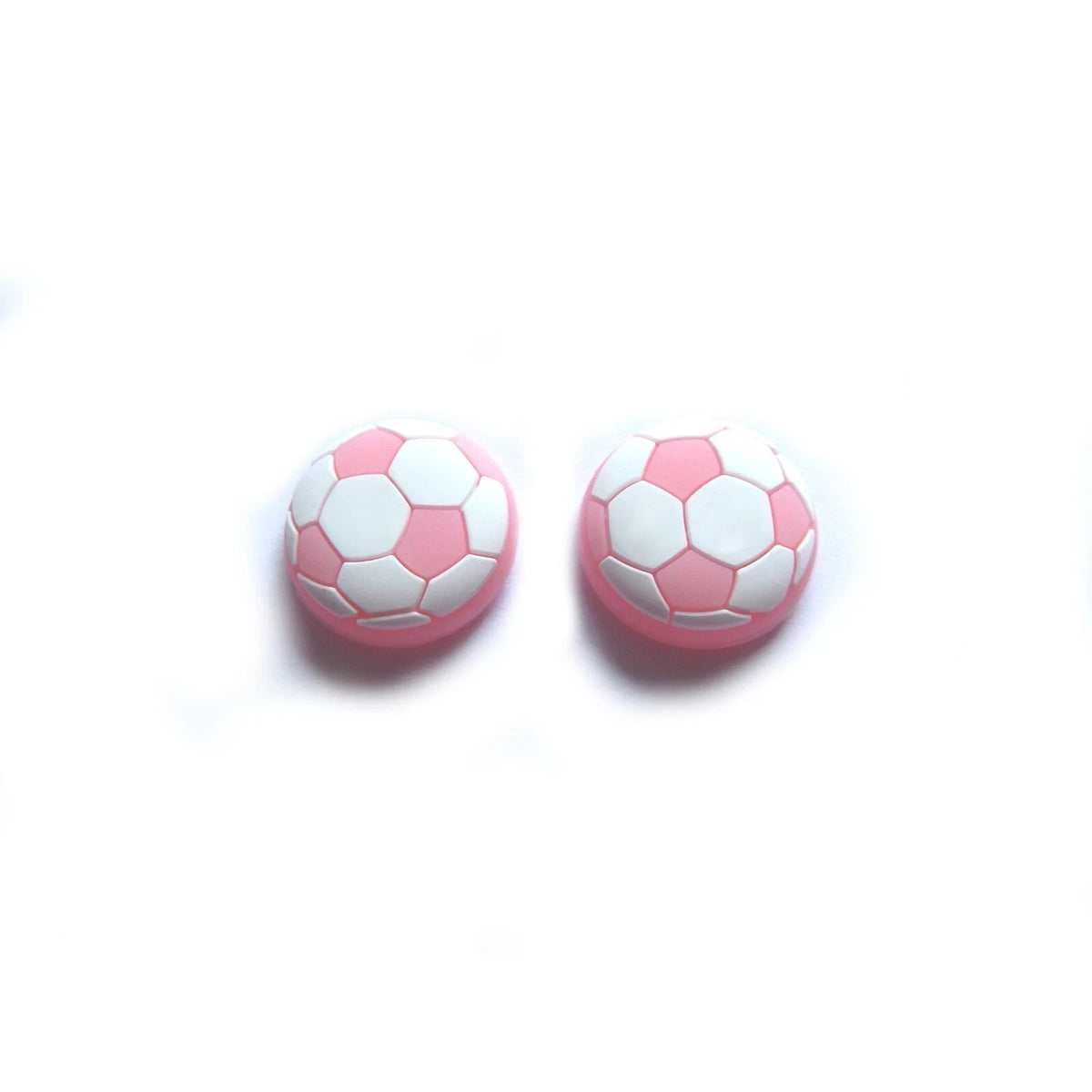 Analogu nykščių svirtelių dangteliai (thumbstick) su futbolo kamuolio dizainu rausvi