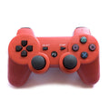 Red gaming controller on a white background ps3 playstation 3
