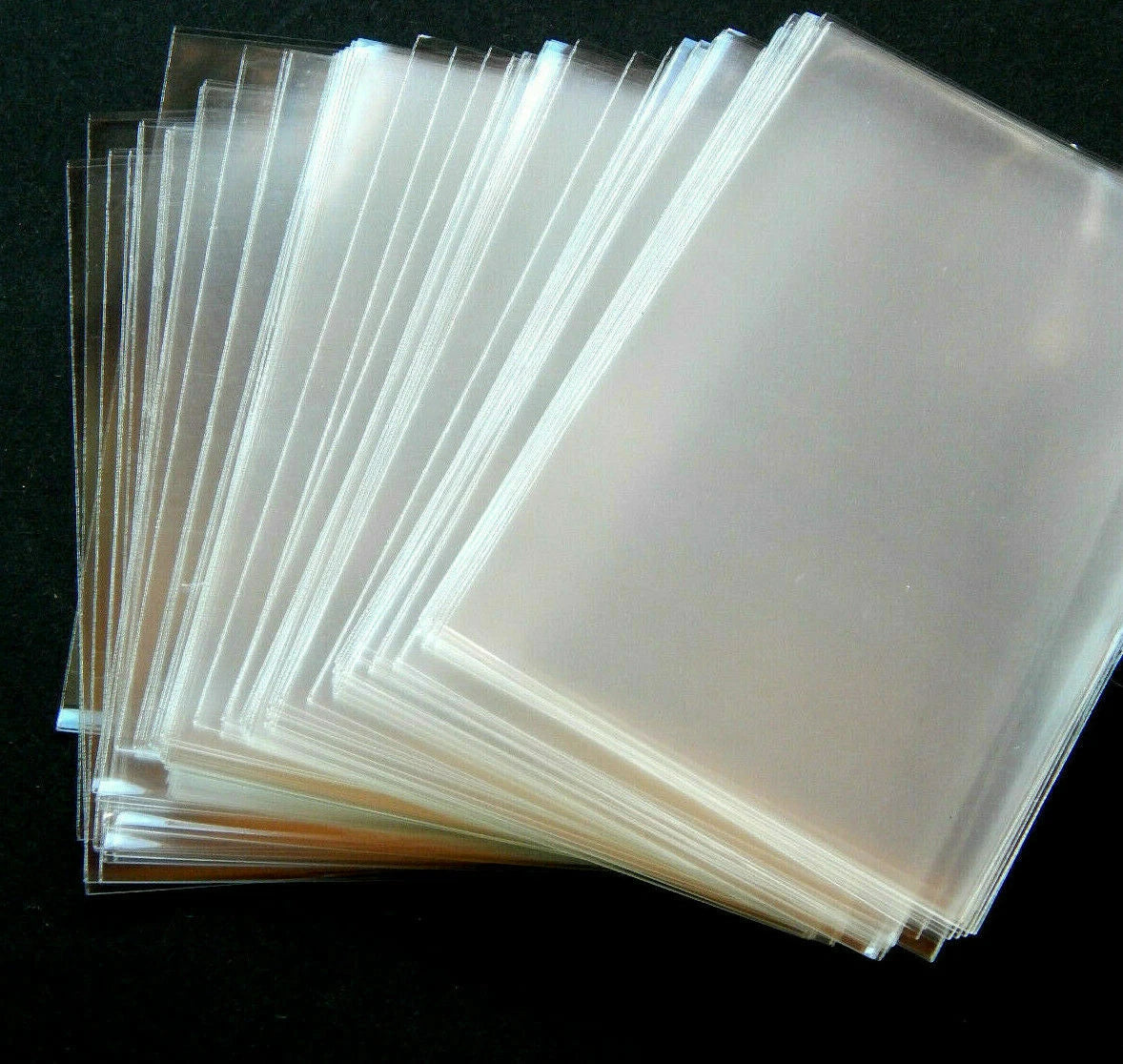 Kortelių dėkliukai įmaitės (card sleeves) – 6×9 cm, skaidrūs, 100/50/20 vnt.