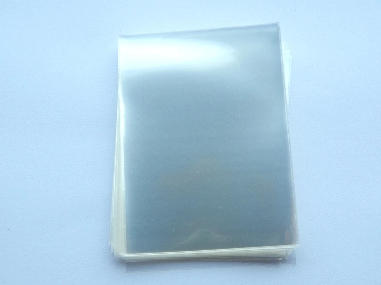 Kortelių dėkliukai įmautės (Card Sleeves Pokemon, MTG) – 6.6×9 cm, skaidrūs, 20/50/100 vnt.